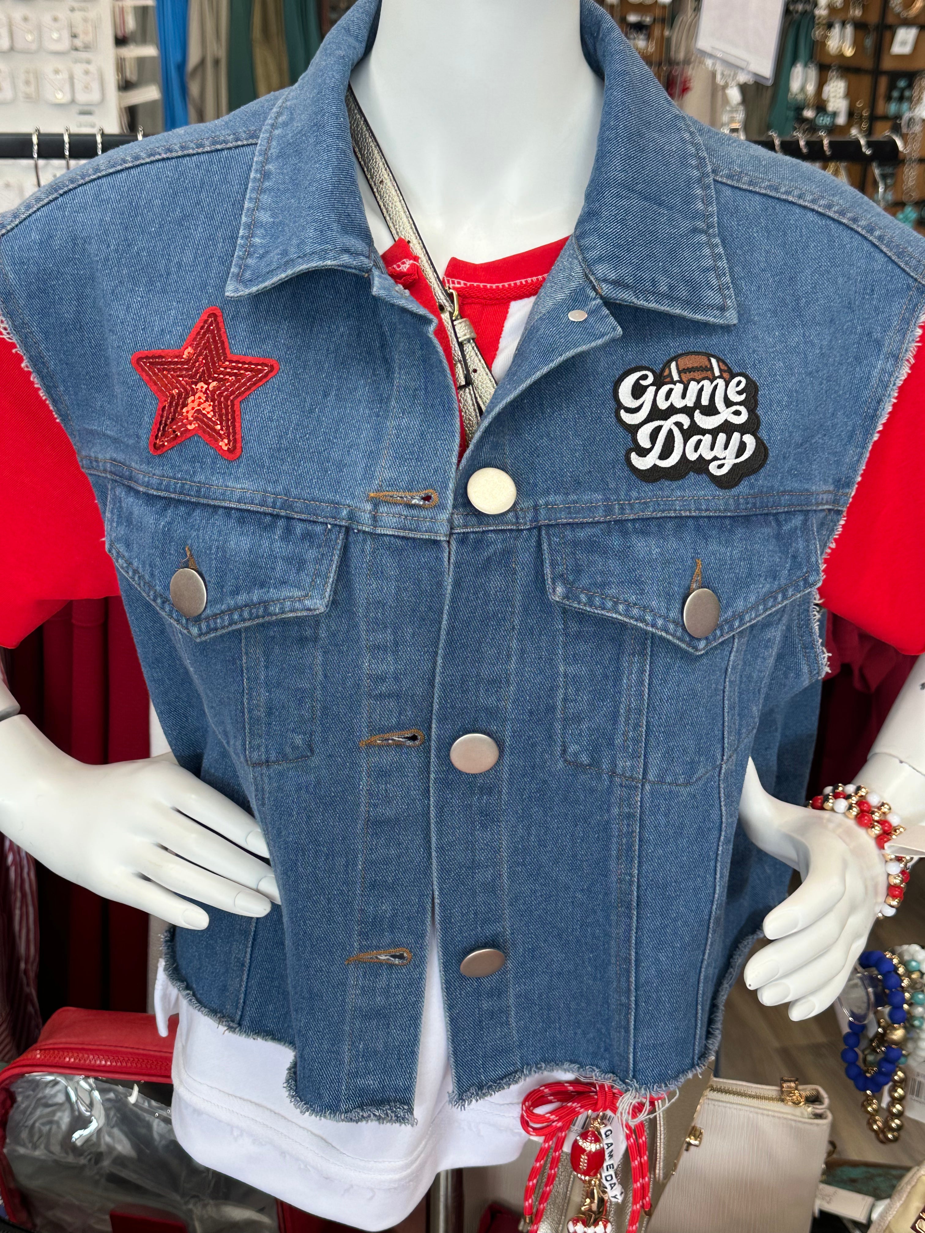 Blue denim vest with star and 'Game Day' patch on a mannequin.