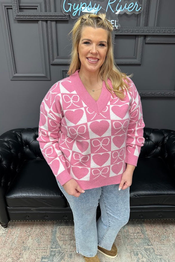 Flattering V-neckline
Ribbed cuffs, neckline, and hem
Relaxed fit that’s easy to wear
bow and heart sweater, V neck sweater, Valentine sweater, heart pattern sweater, women’s novelty sweater, boutique sweaters, Gypsy River Apparel