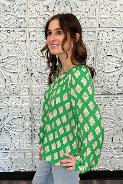 green printed blouse, pink print top, boutique women’s blouse, bold statement blouse, relaxed fit long sleeve top, colorful work blouse