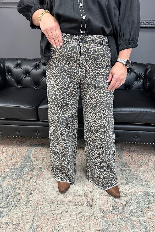 leopard jeans, printed flare jeans, animal print pants, high-rise flares, boutique denim, statement jeans, stretchy jeans, women’s flare jeans, bold style, trendy boutique denim