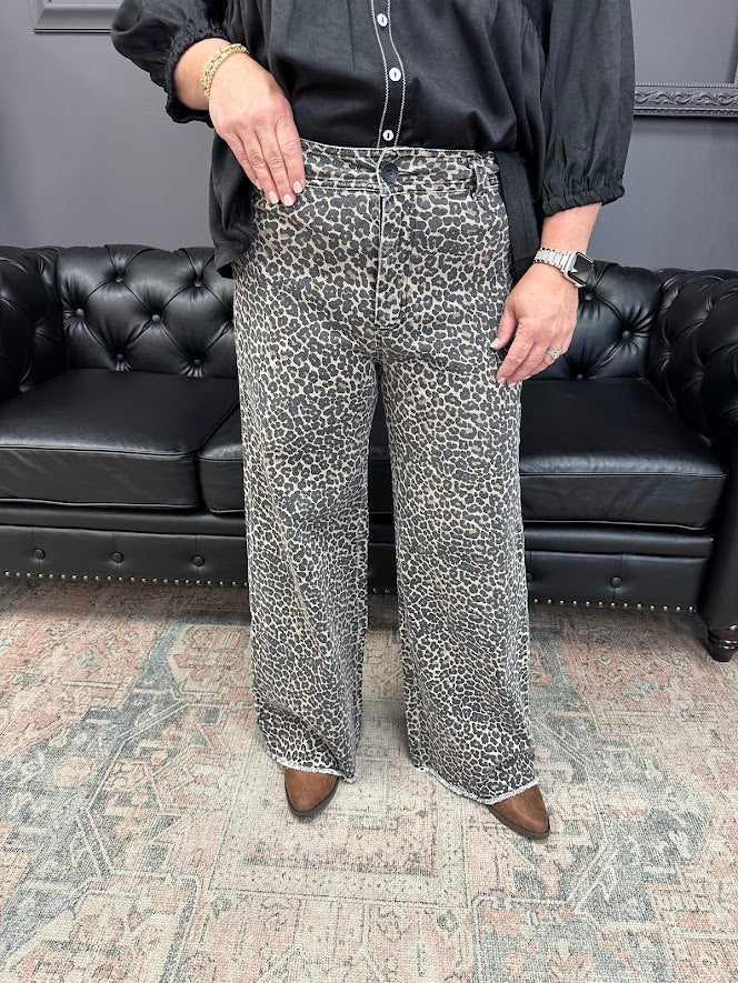leopard jeans, printed flare jeans, animal print pants, high-rise flares, boutique denim, statement jeans, stretchy jeans, women’s flare jeans, bold style, trendy boutique denim