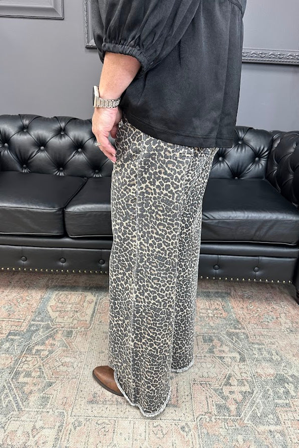 leopard jeans, printed flare jeans, animal print pants, high-rise flares, boutique denim, statement jeans, stretchy jeans, women’s flare jeans, bold style, trendy boutique denim