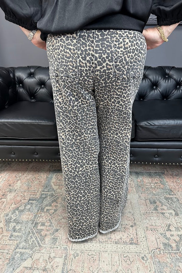 leopard jeans, printed flare jeans, animal print pants, high-rise flares, boutique denim, statement jeans, stretchy jeans, women’s flare jeans, bold style, trendy boutique denim