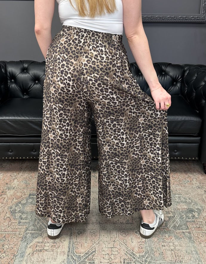 leopard print pants, wide leg pants, skirt pants, flowy pants, animal print bottoms, relaxed fit pants, boutique leopard pants, boho chic pants, elastic waist trousers, fall fashion essentials
