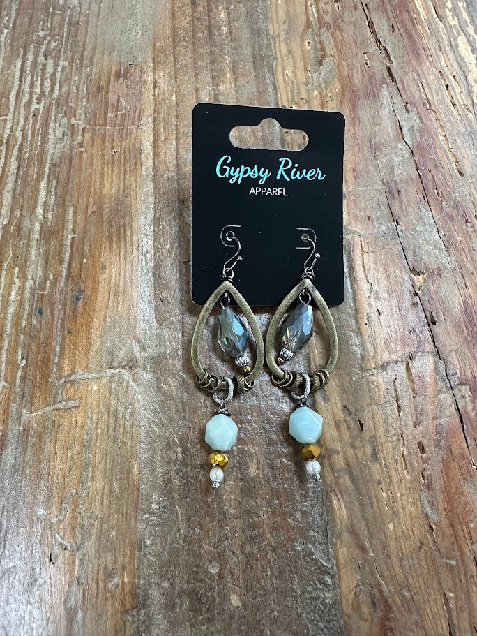Smoky teardrop earrings with mixed bead accents and lightweight fishhook backs — the perfect earthy statement for everyday or dressy looks.