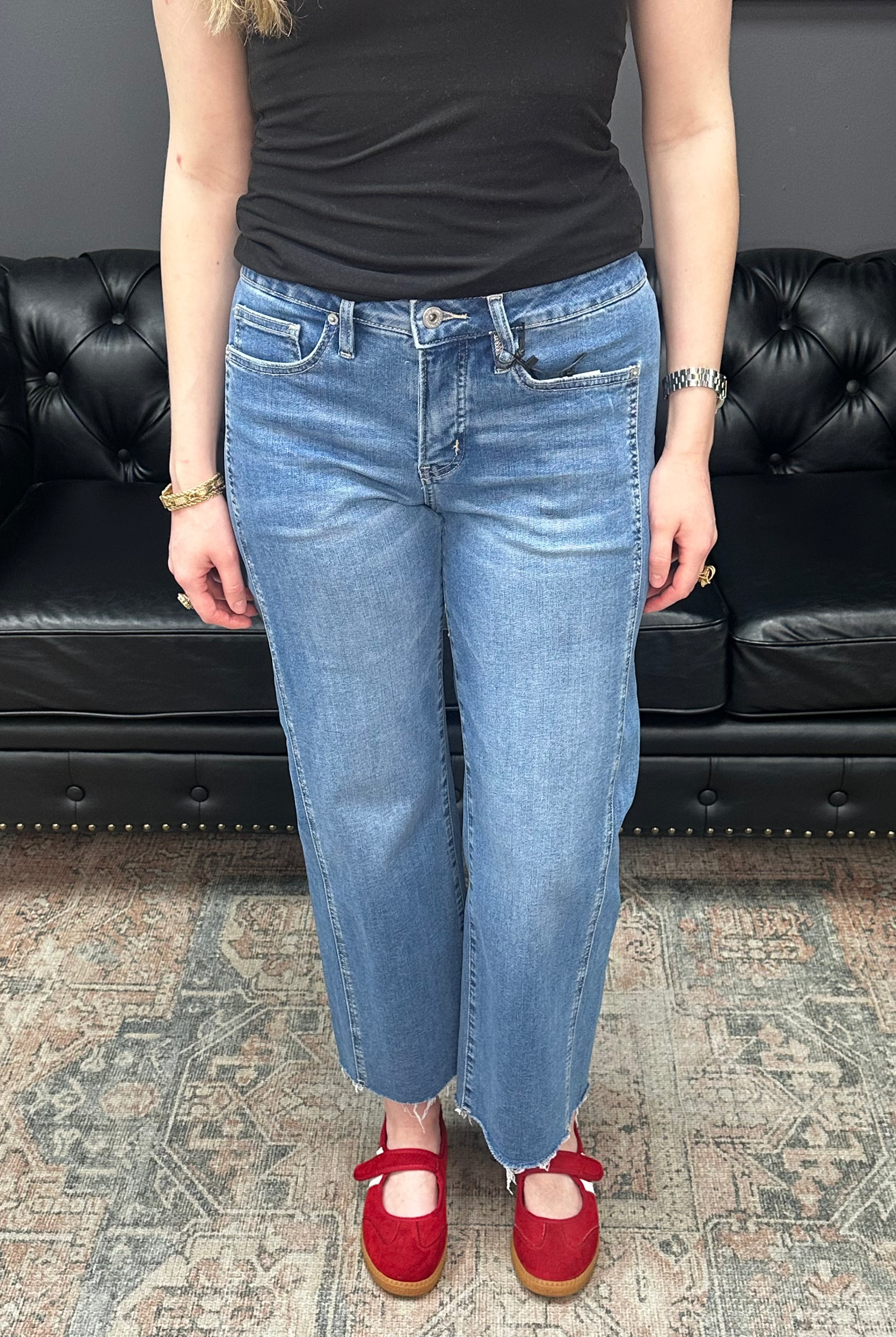 Mid rise tummy tuck cropped straight jeans with raw hem and vertical seam detail for women