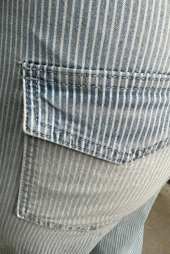 Close-up of a pocket on a striped shirt with a blurred background