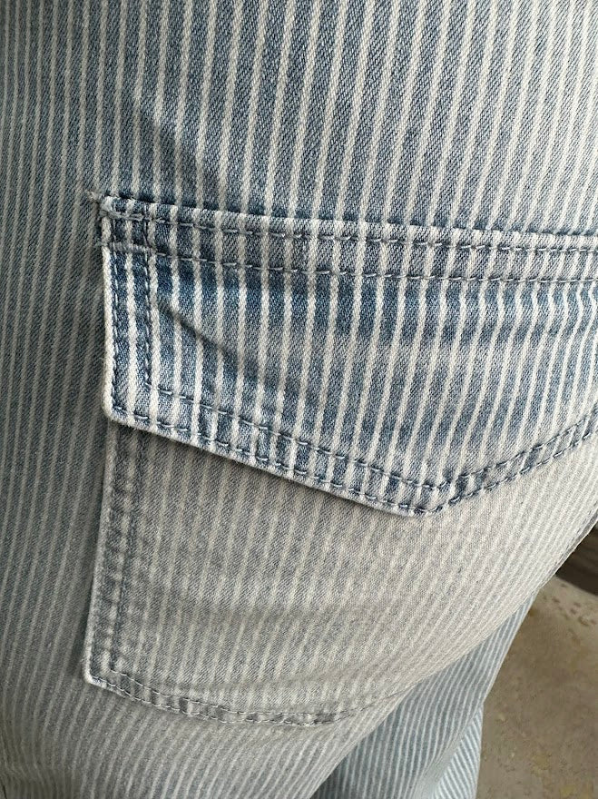 Close-up of a pocket on a striped shirt with a blurred background