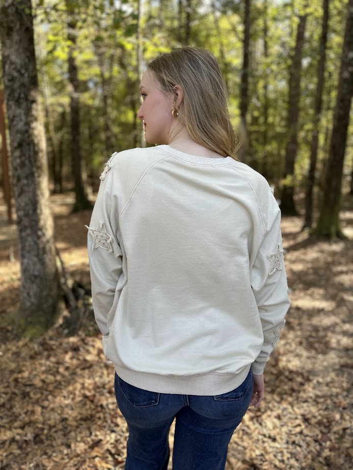 star patch sweatshirt, floral star pullover, mineral washed sweatshirt, relaxed fit cotton top, cozy casual pullover, star detail sweater, 100% cotton sweatshirt, women’s fall pullover, playful casual sweatshirt, everyday loungewear