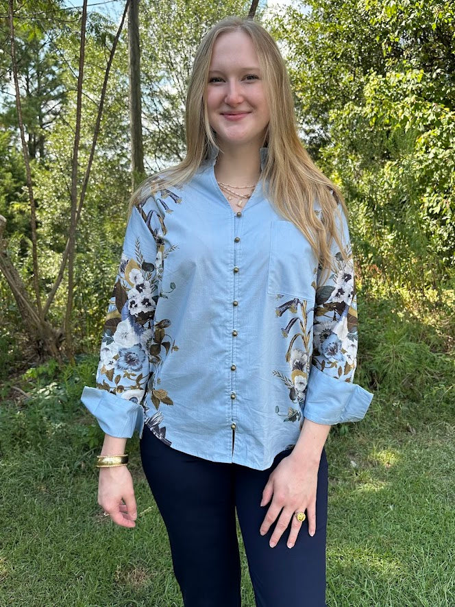 blue floral blouse, ruffle v-neck top, button down floral shirt, long sleeve blouse women, lightweight fall blouse, floral print top, dressy casual blouse, work to weekend top, feminine floral blouse, boutique button shirt, chic office top, floral sleeve blouse, elegant ruffle neckline top, blue floral print shirt, stylish women’s blouse, soft cotton blend blouse, fall floral top, Gypsy River Apparel, Northport boutique clothing, versatile everyday blouse