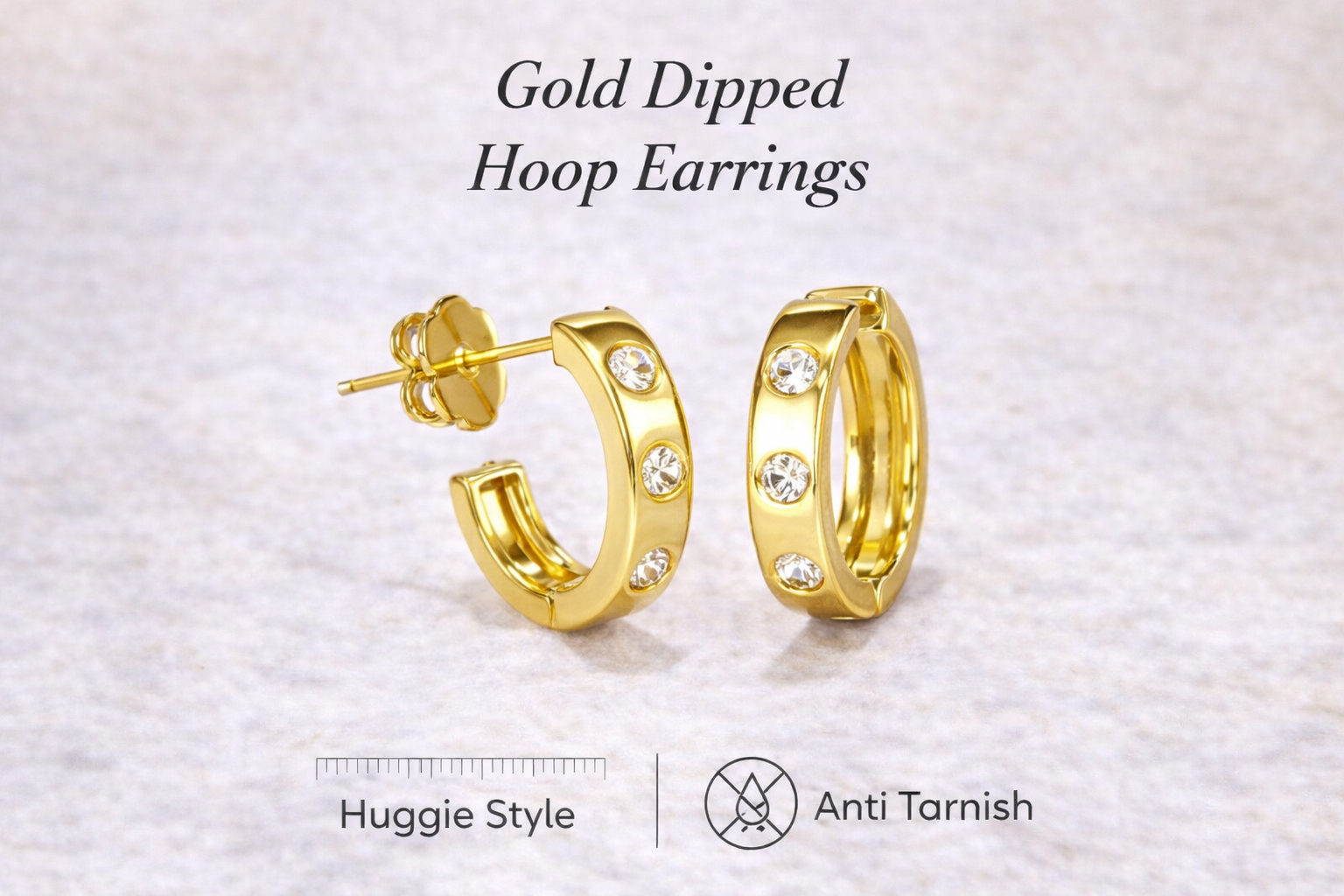Gold-dipped hoop earrings on a light gray background with text indicating 'Gold Dipped Hoop Earrings', 'Huggie Style', and 'Anti Tarnish'.