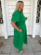curvy green dress, emerald midi dress, plus size midi dress, zip front dress, dresses with pockets, bubble sleeve dress, modest boutique dress