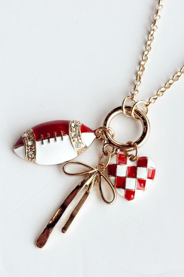 Necklace with football, bow, and checkered flag charms on a white background