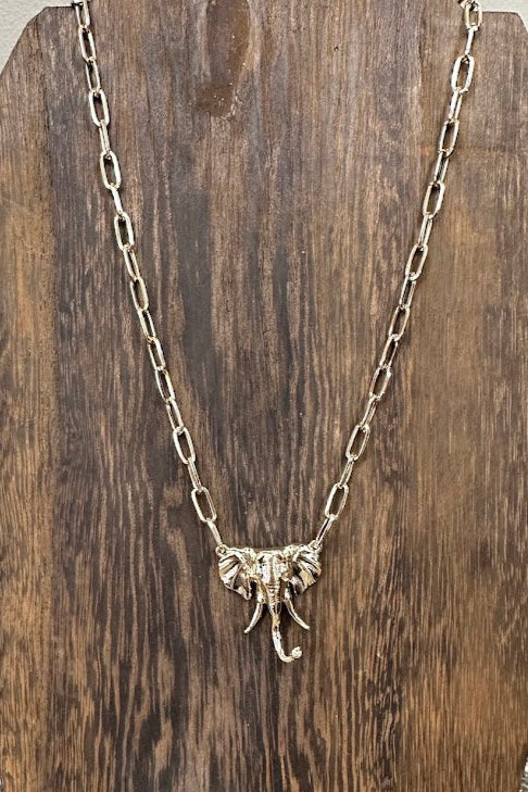 Necklace with an elephant pendant on a wooden stand