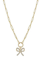 Gold necklace with a bow pendant on a white background