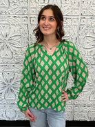 green printed blouse, pink print top, boutique women’s blouse, bold statement blouse, relaxed fit long sleeve top, colorful work blouse
