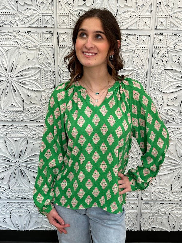 green printed blouse, pink print top, boutique women’s blouse, bold statement blouse, relaxed fit long sleeve top, colorful work blouse