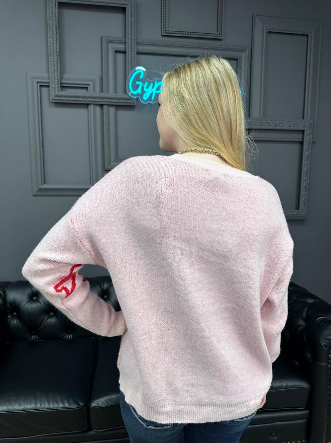 pink bow sweater, holiday sweater, girly knit top, cozy winter sweater, red and pink sweater, boutique knitwear, bow print top, women’s boutique sweater, cute holiday outfit, cozy chic sweater