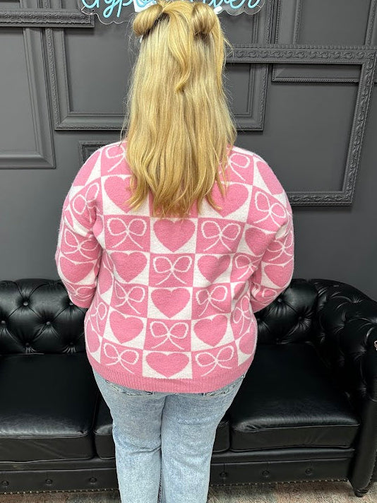 Flattering V-neckline

Ribbed cuffs, neckline, and hem

Relaxed fit that’s easy to wear



bow and heart sweater, V neck sweater, Valentine sweater, heart pattern sweater, women’s novelty sweater, boutique sweaters, Gypsy River Apparel