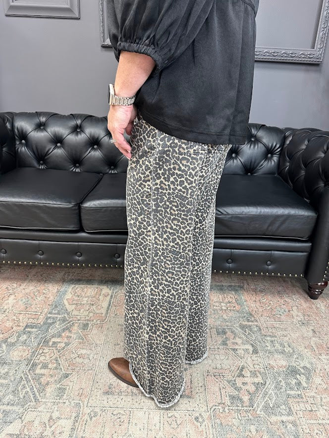leopard jeans, printed flare jeans, animal print pants, high-rise flares, boutique denim, statement jeans, stretchy jeans, women’s flare jeans, bold style, trendy boutique denim