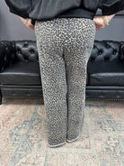 leopard jeans, printed flare jeans, animal print pants, high-rise flares, boutique denim, statement jeans, stretchy jeans, women’s flare jeans, bold style, trendy boutique denim