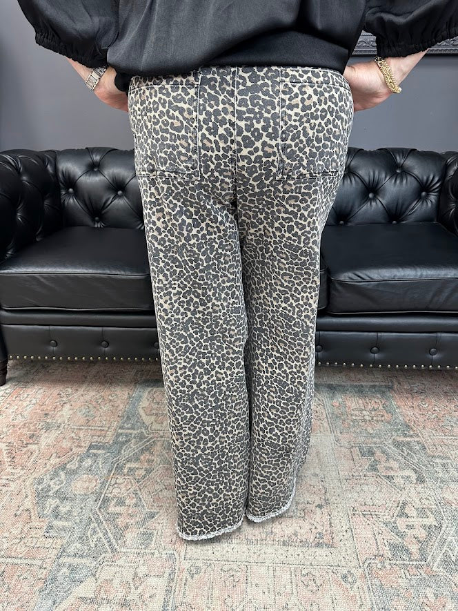 leopard jeans, printed flare jeans, animal print pants, high-rise flares, boutique denim, statement jeans, stretchy jeans, women’s flare jeans, bold style, trendy boutique denim
