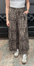 leopard print pants, wide leg pants, skirt pants, flowy pants, animal print bottoms, relaxed fit pants, boutique leopard pants, boho chic pants, elastic waist trousers, fall fashion essentials