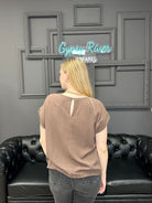 linen blend top, casual blouse, drawstring hem top, relaxed fit shirt, breathable linen top, boutique casual top, short sleeve blouse, neutral summer top, soft lightweight shirt, everyday essentials