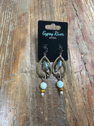 Smoky teardrop earrings with mixed bead accents and lightweight fishhook backs — the perfect earthy statement for everyday or dressy looks.