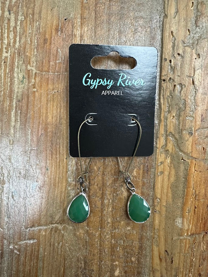 Faceted green teardrop earrings with silver-tone detail. Lightweight, elegant, and the perfect pop of color for any outfit.