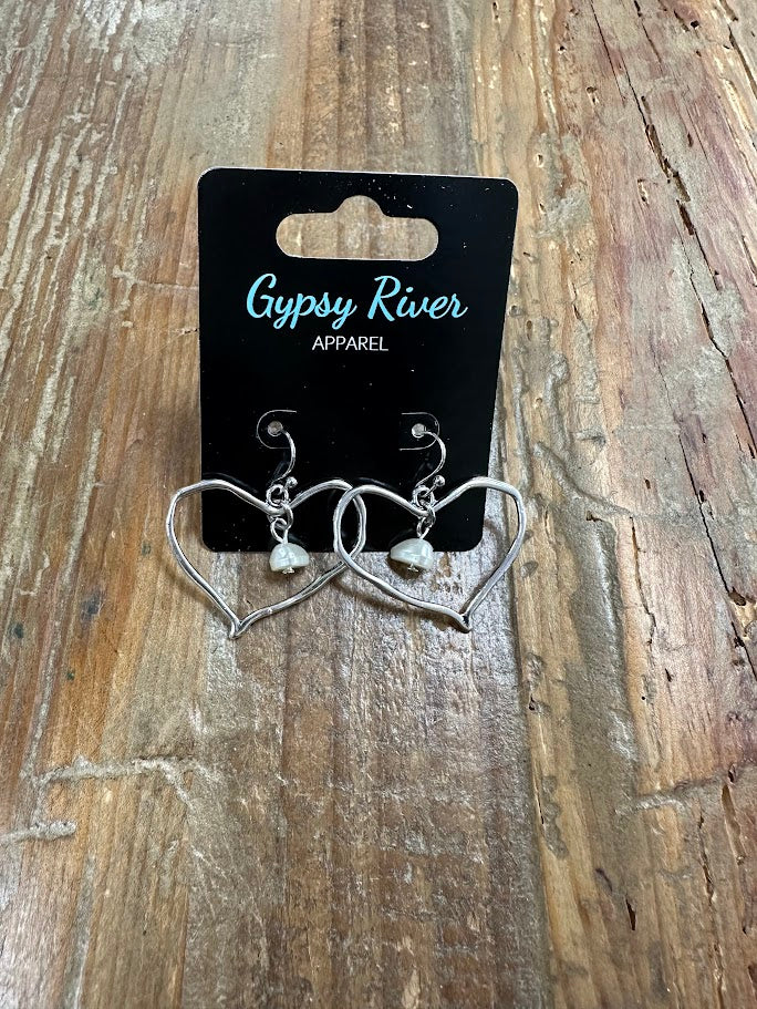 Lightweight silver open-heart earrings with delicate bead detail. Sweet, simple, and perfect for everyday wear.