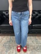 Mid rise tummy tuck cropped straight jeans with raw hem and vertical seam detail for women