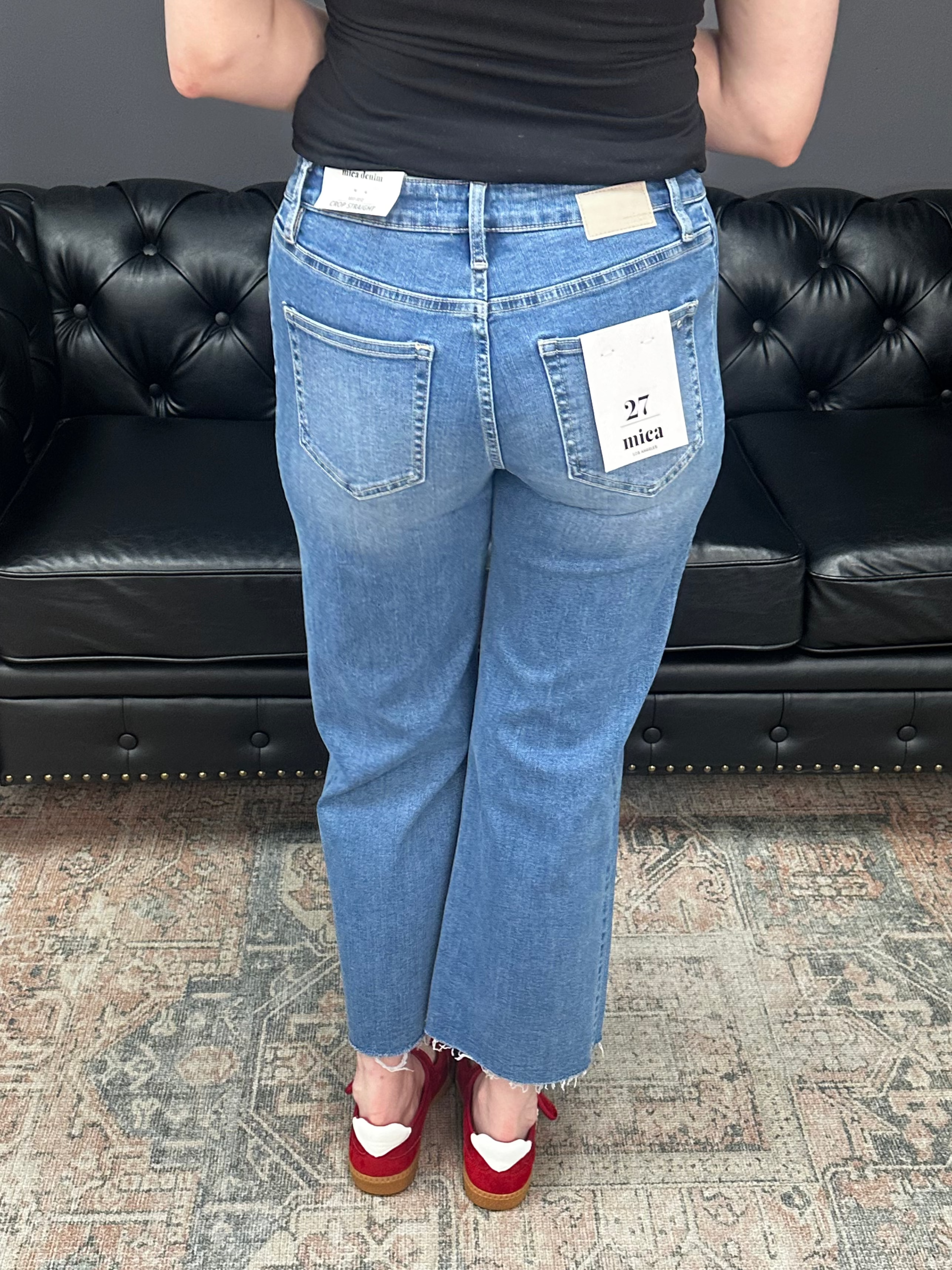 Mid rise tummy tuck cropped straight jeans with raw hem and vertical seam detail for women