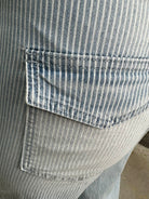 Close-up of a pocket on a striped shirt with a blurred background