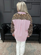 leopard trim top, striped button down blouse, oversized statement top, mixed print blouse, women’s boutique tops, bold contrast blouse