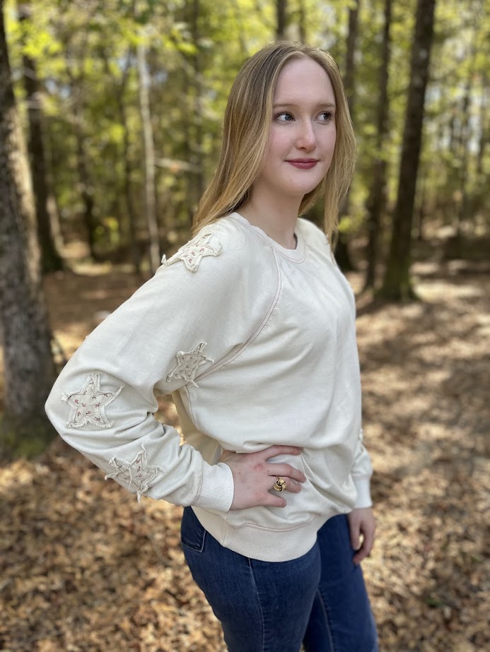 star patch sweatshirt, floral star pullover, mineral washed sweatshirt, relaxed fit cotton top, cozy casual pullover, star detail sweater, 100% cotton sweatshirt, women’s fall pullover, playful casual sweatshirt, everyday loungewear
