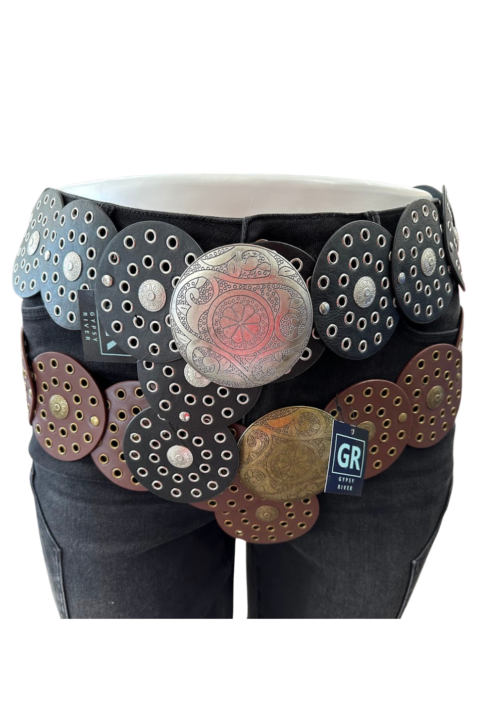 Western-inspired concho belt with engraved buckle—available in brown/gold or black/silver. The statement piece your outfit needs.