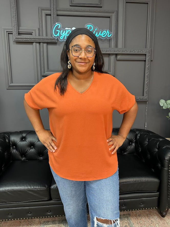 Gypsy River Apparel – Women’s textured V-neck tops in rust orange, teal, and beige, lightweight short sleeve boutique blouses in regular and plus sizes.