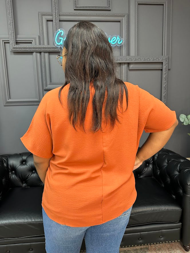 Gypsy River Apparel – Women’s textured V-neck tops in rust orange, teal, and beige, lightweight short sleeve boutique blouses in regular and plus sizes.