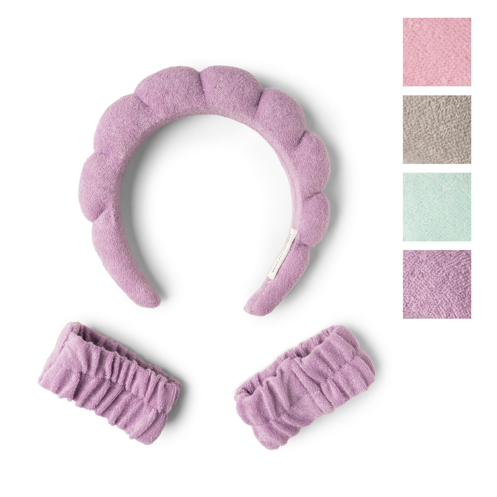 Pink textured headband with matching hair bands on a white background