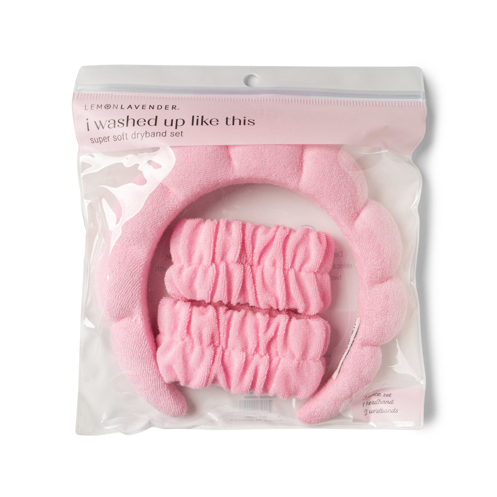 Pink bath mitt and scrubber set in packaging with 'i washed up like this' text.