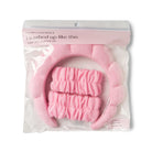 Pink bath mitt and scrubber set in packaging with 'i washed up like this' text.